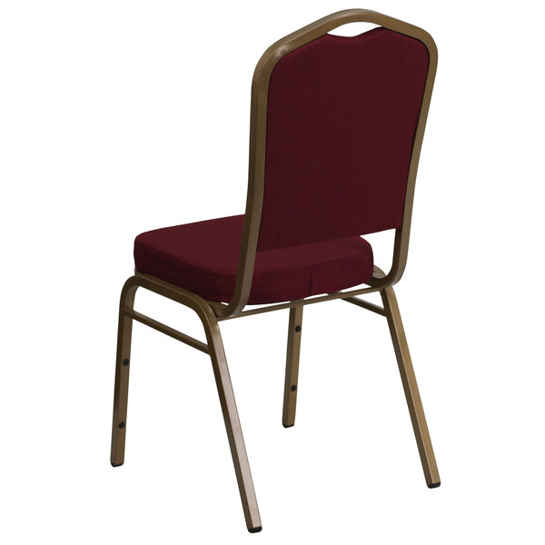 A burgundy Flash Furniture banquet chair with gold frame.