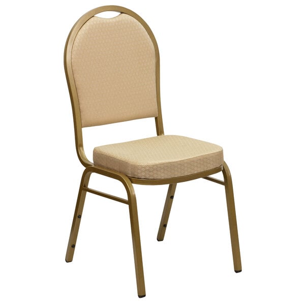 A beige Flash Furniture banquet chair with a cushion on the seat and gold legs.