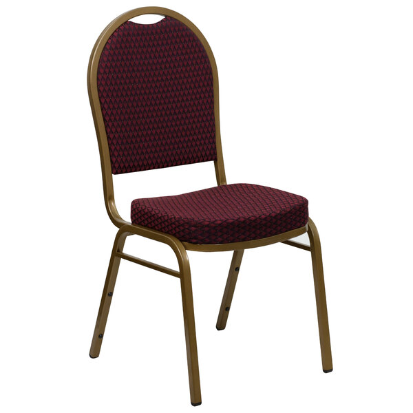 A red banquet chair with a gold frame and burgundy patterned cushion.