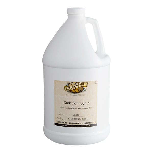 A large white plastic jug with a handle and a label indicating it contains Golden Barrel Dark Corn Syrup.