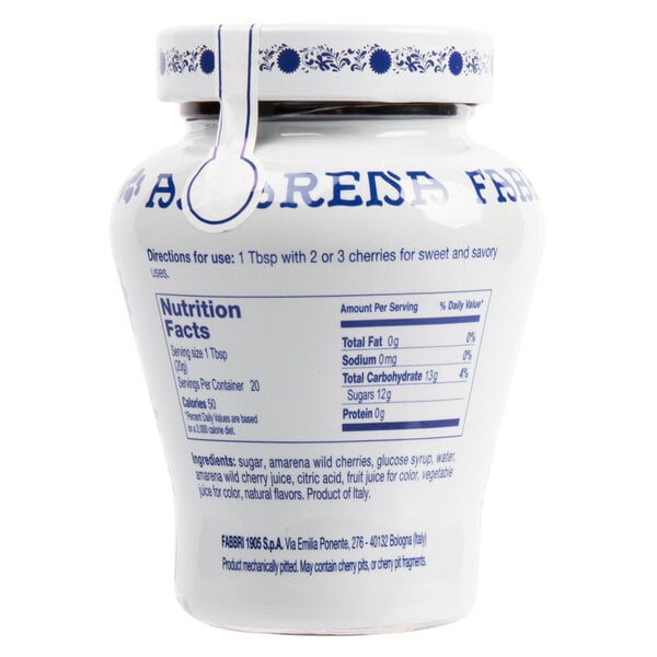 A white Fabbri jar with blue text containing Amarena cherries in syrup.