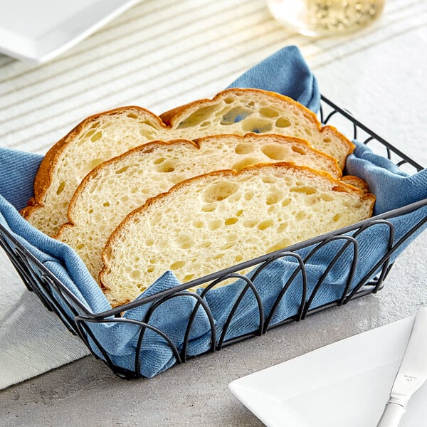 Slices of King's Hawaiian Original Hawaiian Sweet Round Bread in a wire basket.