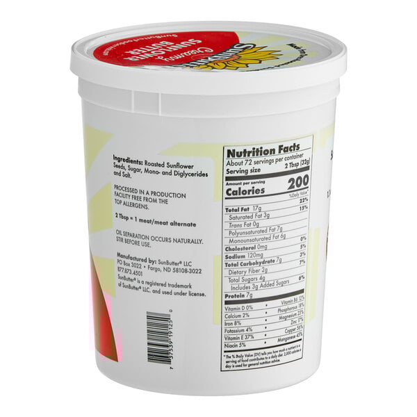 A white container of SunButter Creamy Sunflower Spread with a red and white label and lid.