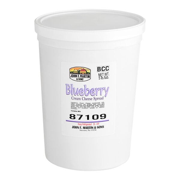 A white John F. Martin container of Blueberry Cream Cheese Spread with a white lid and label.