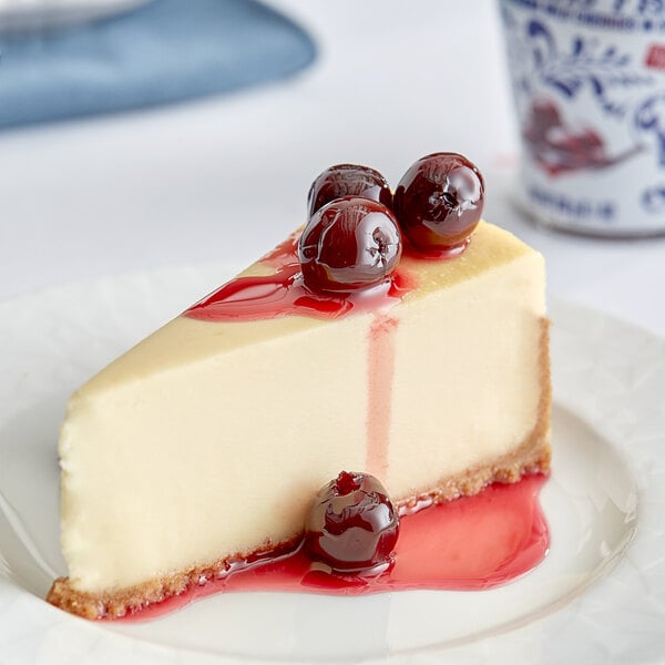 A slice of cheesecake with Fabbri Amarena cherries on top.