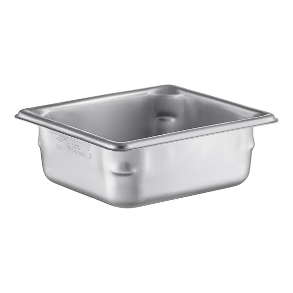 A Vollrath stainless steel 1/6 size steam table pan on a white counter.