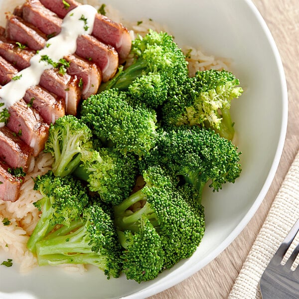 A plate of food with broccoli.