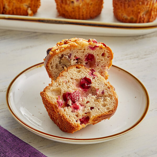 A cranberry walnut muffin made with Bake'n Joy Ultra Moist Muffin Mix on a plate.