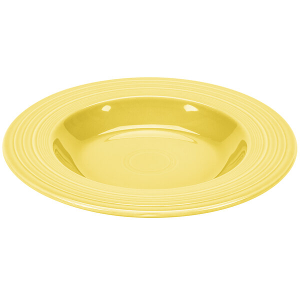 a yellow plate with a white circle