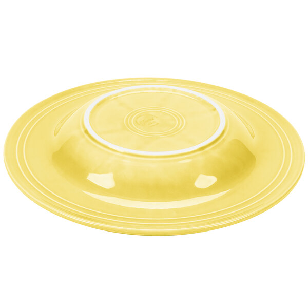 A yellow Fiesta pasta bowl with a white rim and center circle.