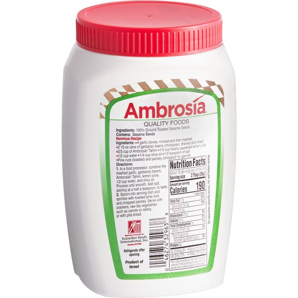 A white plastic container of All-Natural Tahini Paste with a red lid.