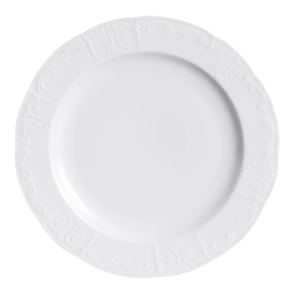 A bright white china plate with a subtle embossed pattern around the rim.