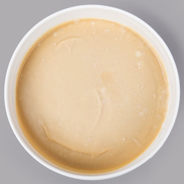 A bowl of Bake'n Joy French vanilla muffin batter on a white surface.
