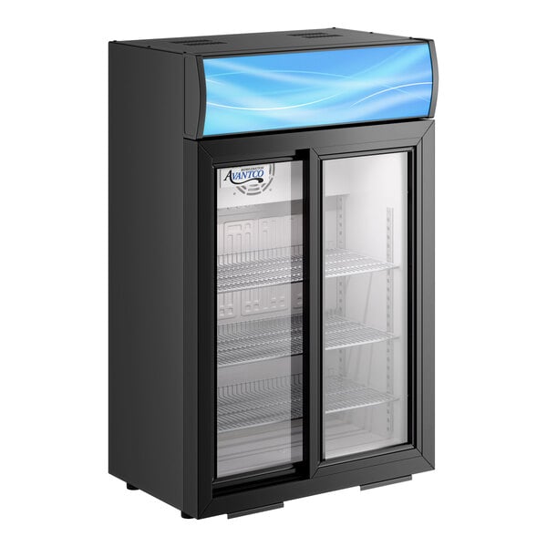 A black countertop display refrigerator with sliding glass doors, interior shelves, and a blue-lit merchandising panel at the top.