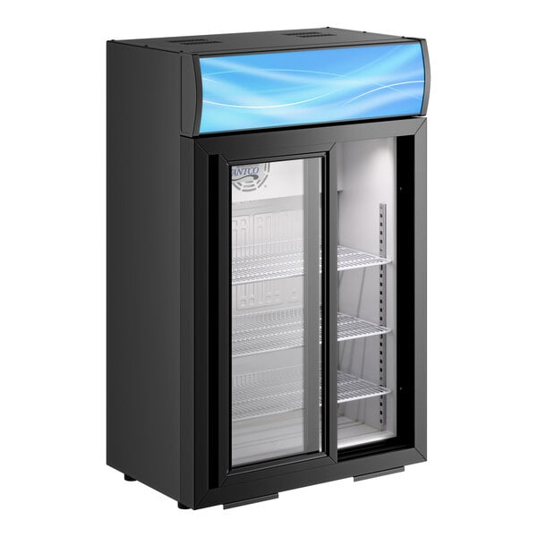 A black countertop display refrigerator with a glass sliding door, interior shelves, and a blue-lit merchandising panel at the top.