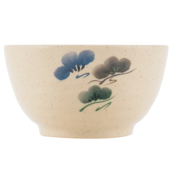 A white melamine bowl with a blue floral design.
