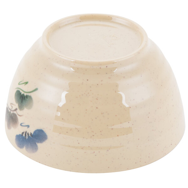 A white bowl with a blue flower design.