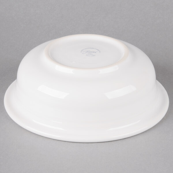 A white Fiesta serving bowl on a gray surface.