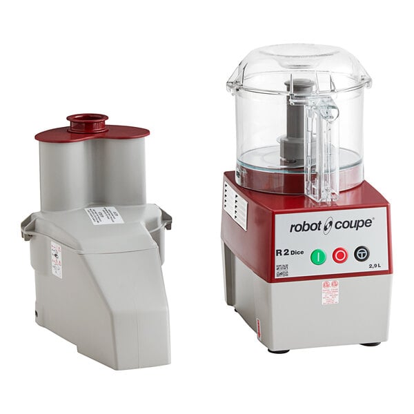 A Robot Coupe R2CLR DICE food processor with a clear container and lid.
