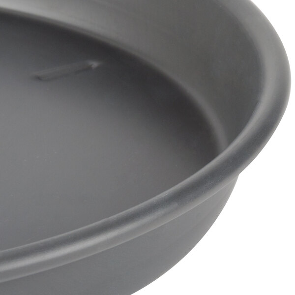 A black Chicago Metallic deep dish pizza pan.
