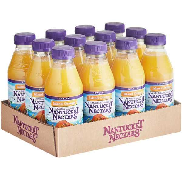 A cardboard box of 12 Nantucket Nectars Premium Orange Juice bottles.