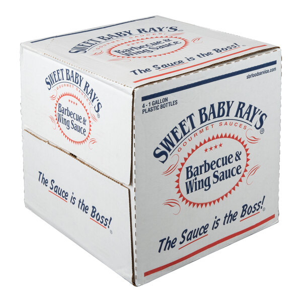 A cardboard box labeled 'Sweet Baby Ray's Barbecue & Wing Sauce' with the slogan 'The Sauce is the Boss!' printed on its sides.