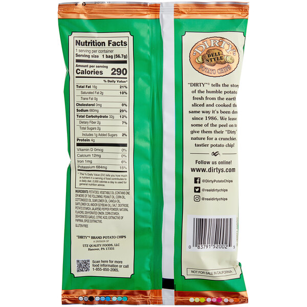 A close-up of a Dirty Potato Chips Jalapeno Heat bag with a green and white label with white and black text.