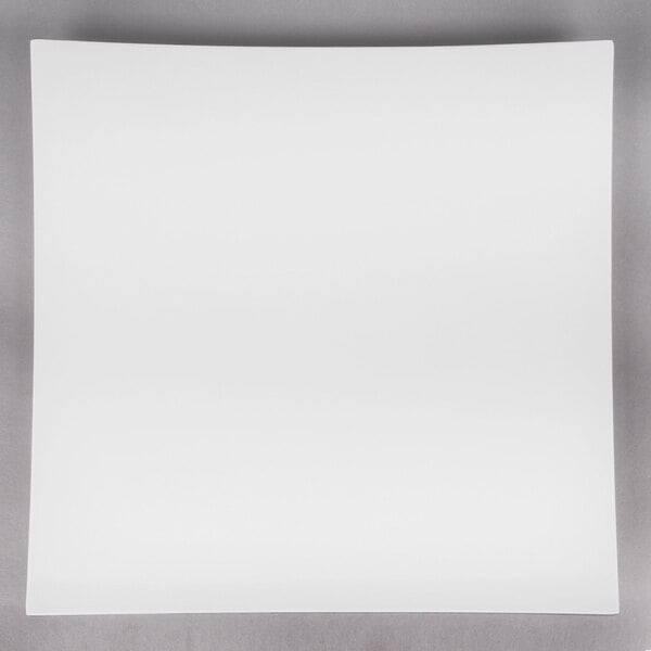 An American Metalcraft white square melamine platter on a gray surface.