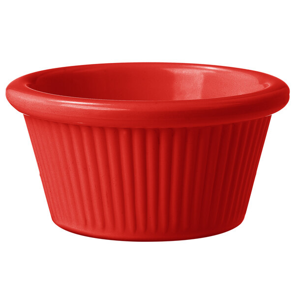 A red fluted melamine ramekin.