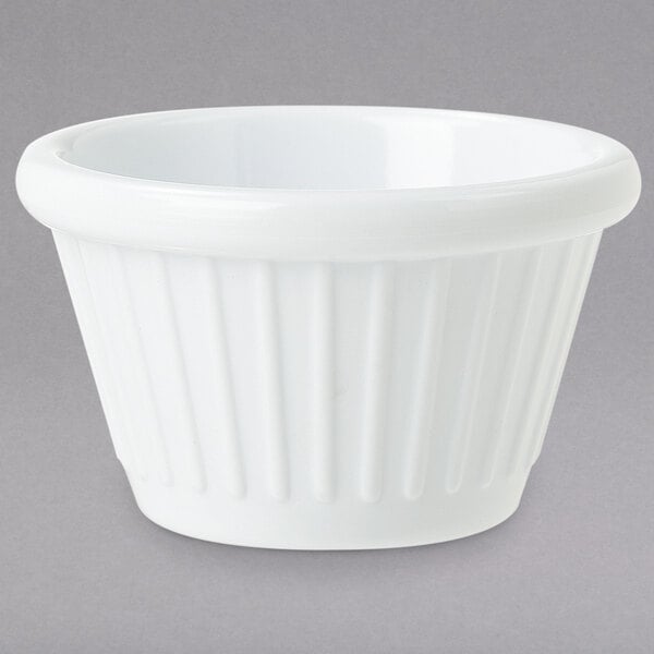 A white fluted melamine ramekin.