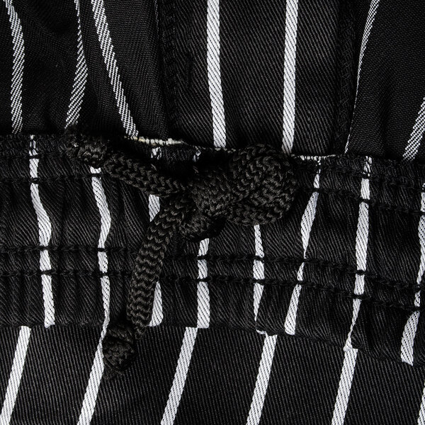 Chef Revival unisex pinstripe chef pants in black and white stripes on a white background.