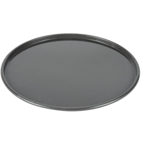 A round black Chicago Metallic pizza pan.