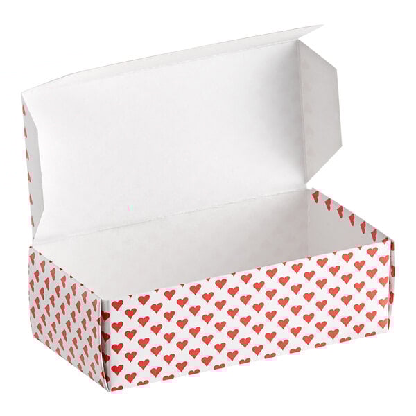 A white Valentine's Day heart candy box with red hearts on it.
