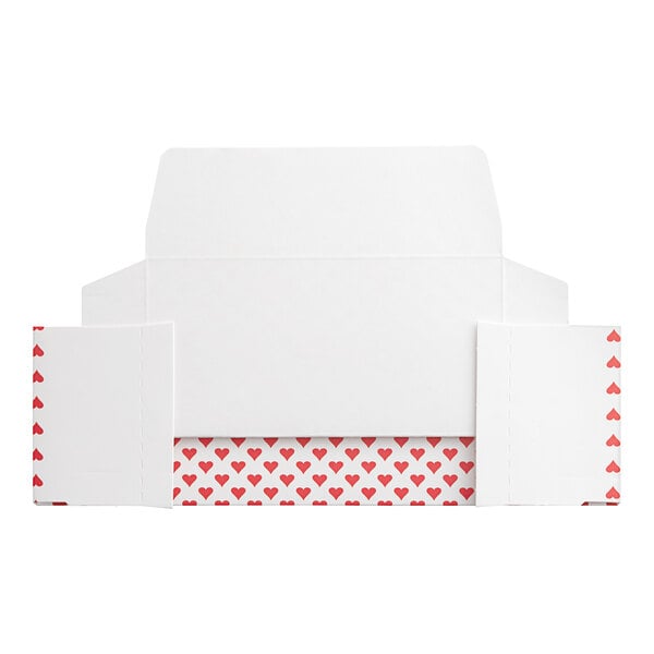 A white box with red heart patterns on it.