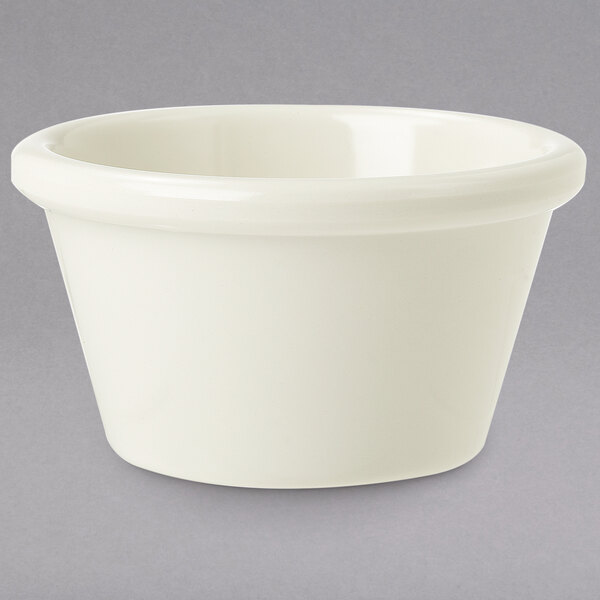 A white GET smooth melamine ramekin on a gray surface.
