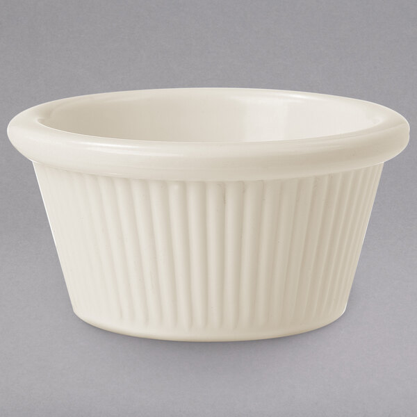 A white fluted melamine ramekin.