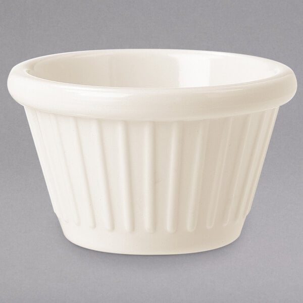 An ivory fluted melamine ramekin.