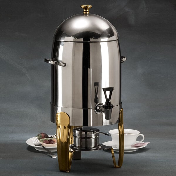 An American Metalcraft stainless steel coffee urn with a gold handle.