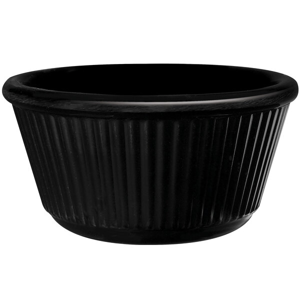 A black fluted melamine ramekin with a black rim.