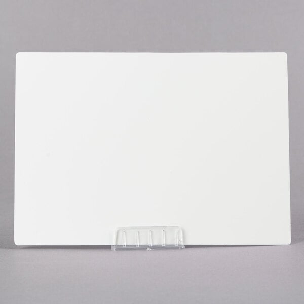 A white rectangular paper with a clear plastic holder on top.