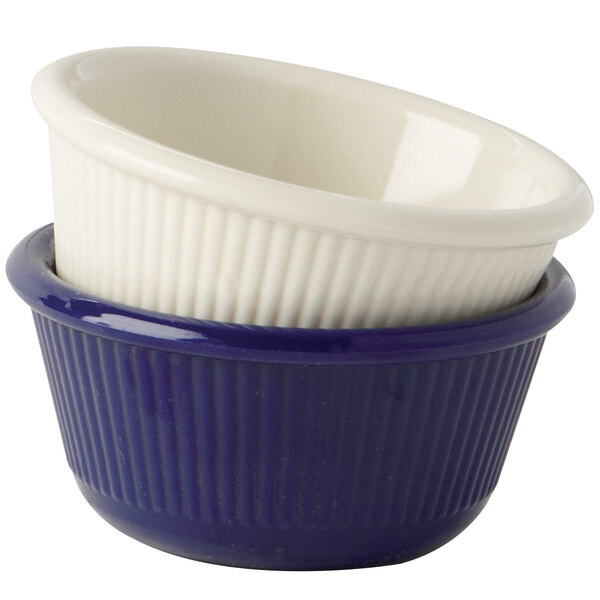 A close-up of a cobalt blue fluted ramekin.
