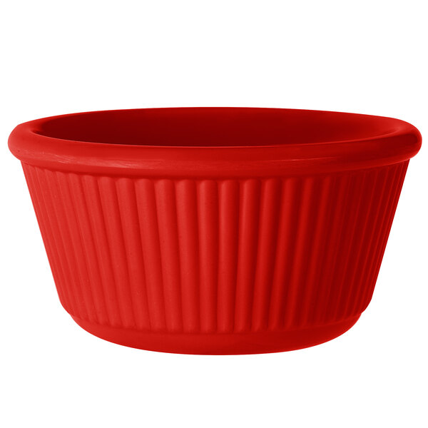 A red fluted melamine ramekin.