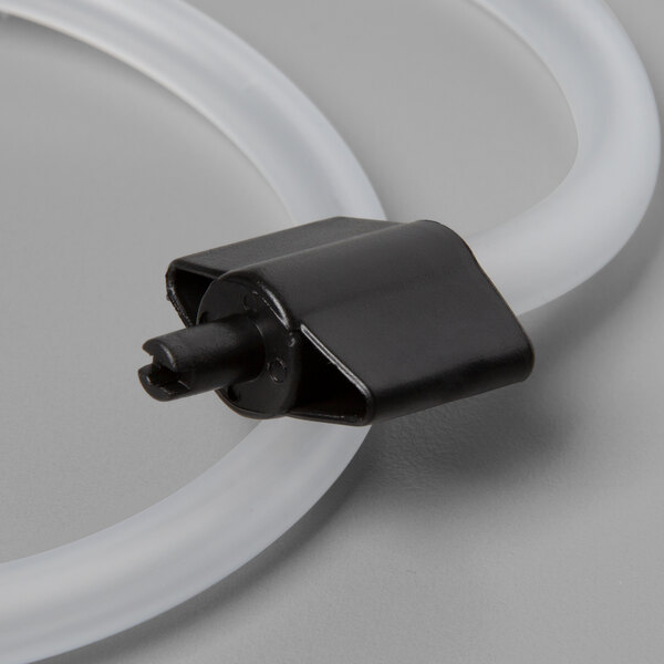 A black plastic tube with a white plastic connector.