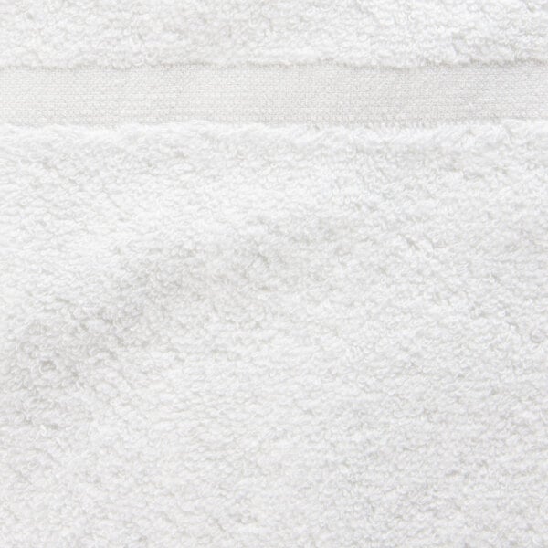 A close up of a white Oxford Belleeza bath mat.