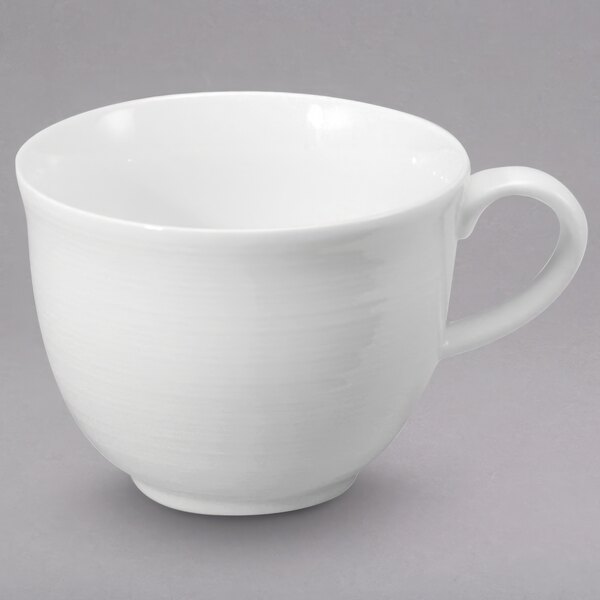 A Sant' Andrea Botticelli bright white porcelain tall cup with a handle.