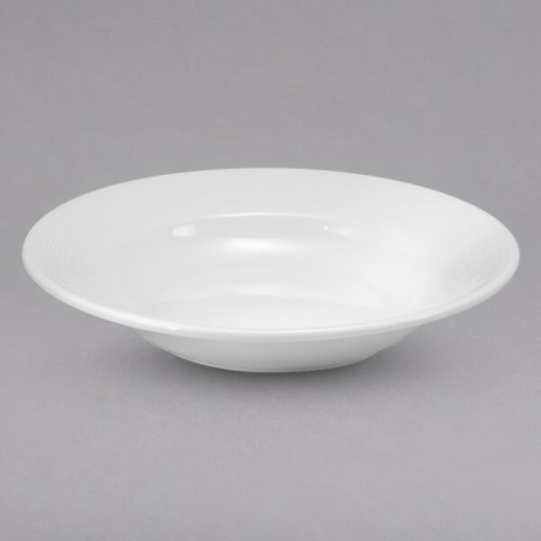 A bright white Sant' Andrea Botticelli porcelain rim deep soup bowl.