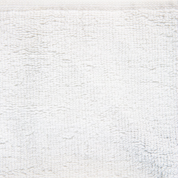 A close-up of an Oxford Platinum white wash cloth with a white dobby twill border.