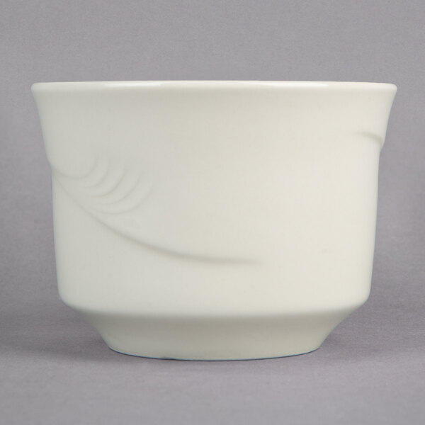A white Oneida China bouillon cup with a swirly design.