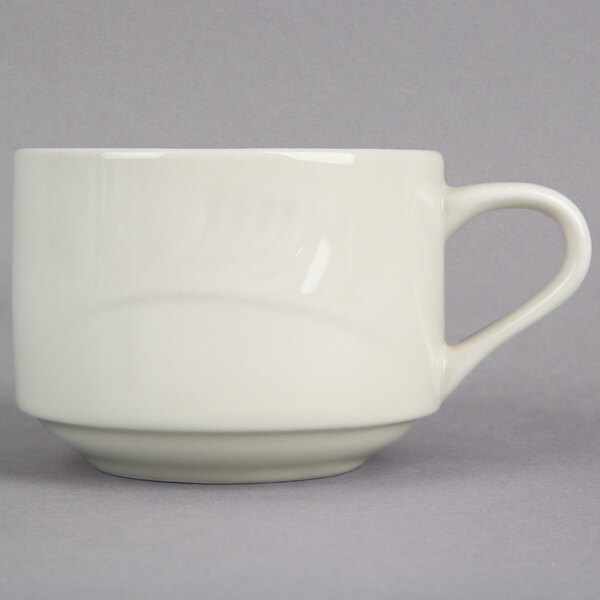 A close-up of a white Oneida Odyssey cup with a handle.