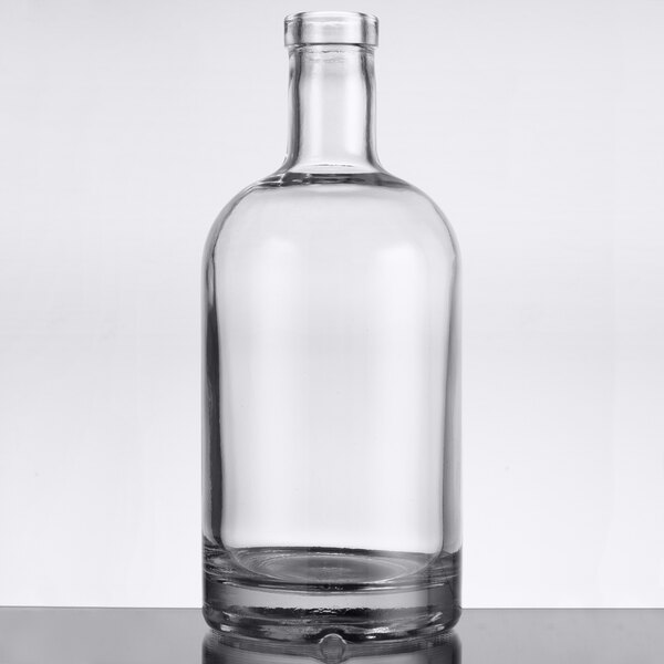 An Anchor Hocking clear glass bottle with a silver lid.